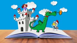 immagine grafica di un libro aperto con sopra un castello, un drago ed un cavaliere